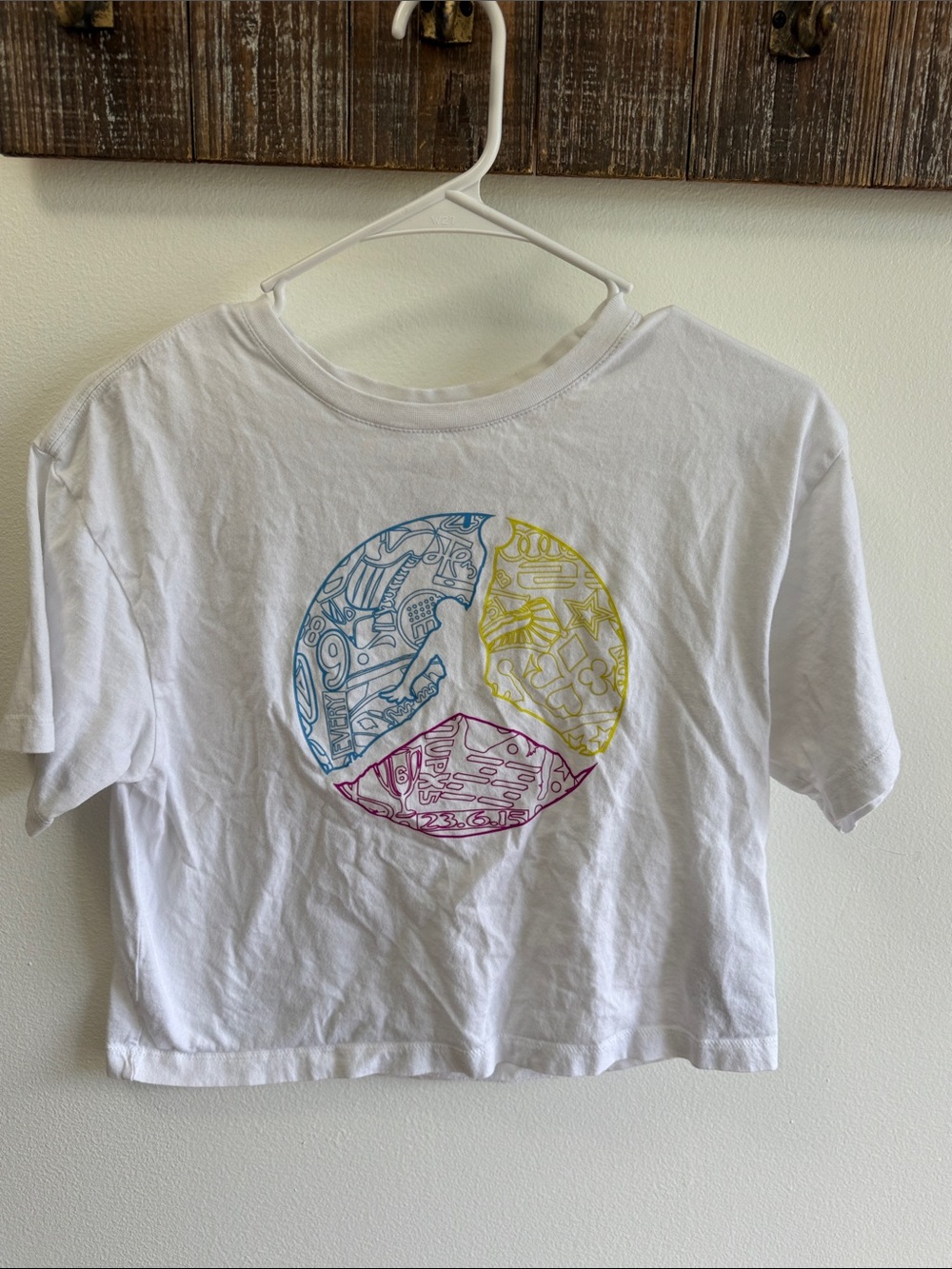 Jordan White Cropped Tee with Blue, Yellow & Pink Peace Graphic